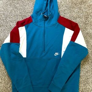 Turquoise, white and maroonish quarter zip Nike Men’s hoodie.